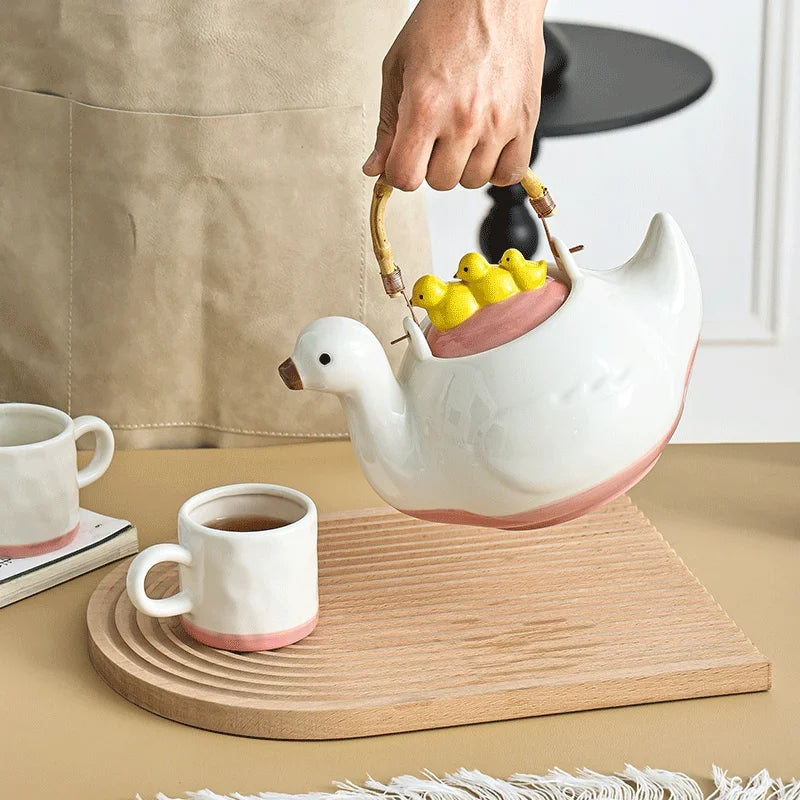 Ceramic duck-shaped water kettle, a charmingly designed cool water jug, suitable for afternoon tea teapot and cups.
