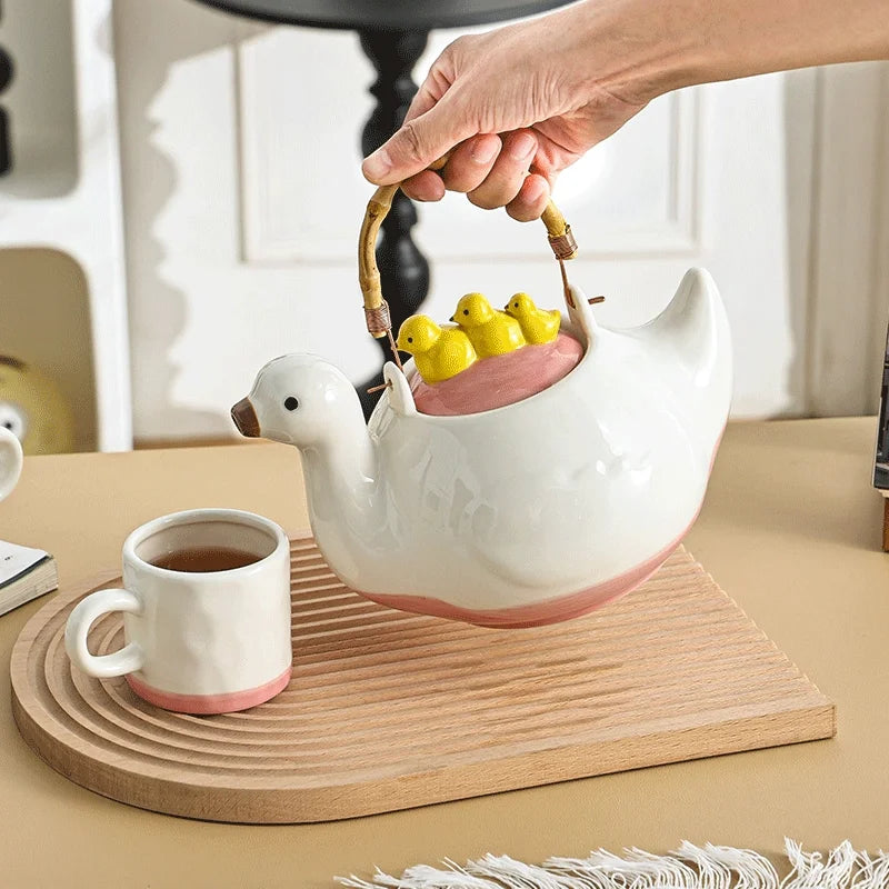 Ceramic duck-shaped water kettle, a charmingly designed cool water jug, suitable for afternoon tea teapot and cups.